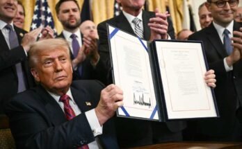 President Trump displays the law on engineering - the first major cryptography legislation adopted by the congress - after having signed it at the White House in Washington, DC, on July 18, 2025.